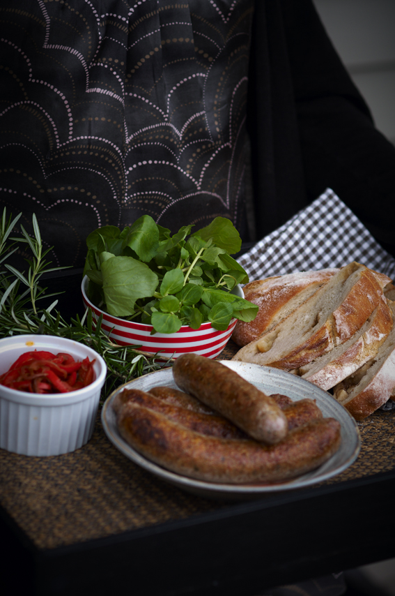 Whole roasted garlic Ciabatta knot w BBQ sausages Red pepper relish