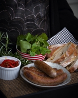 Whole roasted garlic Ciabatta knot w BBQ sausages Red pepper relish